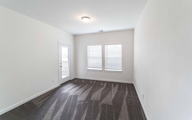 8406 Crab Blossom Dr, Cypress, TX 77433 - spare room with visible vents, baseboards, and dark carpet