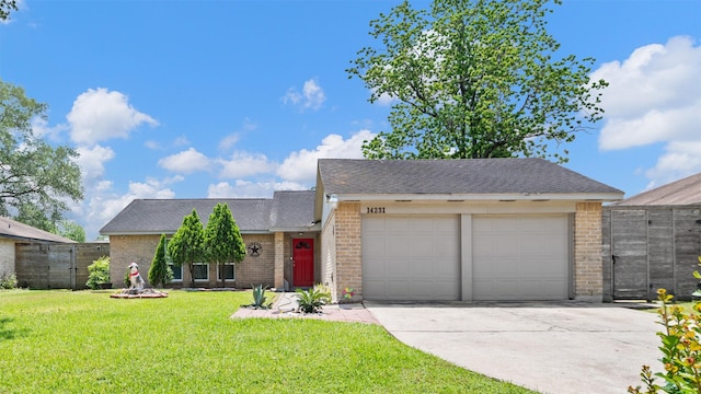 14231 Bateau Dr, Cypress, TX 77429 - view of front facade with concrete driveway, brick siding, an attached garage, and a front lawn