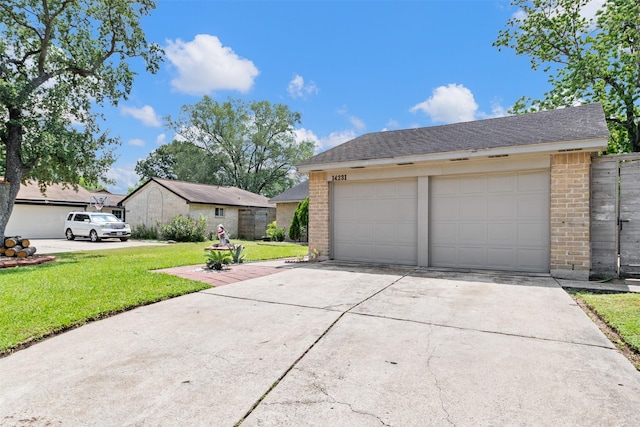 14231 Bateau Dr, Cypress, TX 77429 - ranch-style home featuring roof with shingles, a garage, brick siding, and a front yard