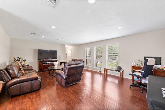 14231 Bateau Dr, Cypress, TX 77429 - living area featuring dark wood-style flooring, a textured ceiling, and visible vents