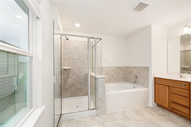 14627 Monterey Cypress Dr, Houston, TX 77068 - bathroom with vanity, visible vents, recessed lighting, a stall shower, and a bath