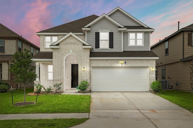 14627 Monterey Cypress Dr, Houston, TX 77068 - view of front facade featuring brick siding, a garage, concrete driveway, a front yard, and roof with shingles