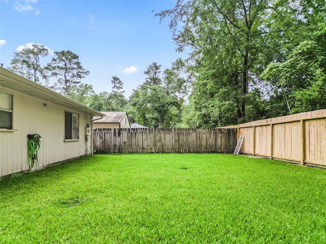 view of yard featuring a fenced backyard