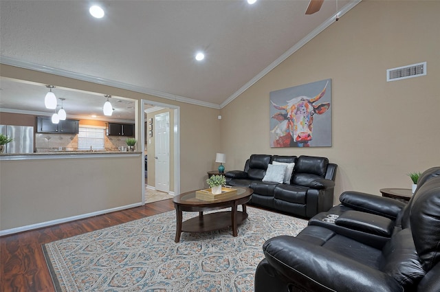 living room with wood finished floors, visible vents, lofted ceiling, ornamental molding, and recessed lighting