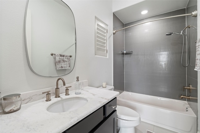 full bath with toilet,  shower combination, vanity, and recessed lighting
