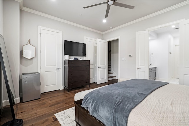 bedroom with recessed lighting, baseboards, ensuite bath, crown molding, and dark wood-style floors