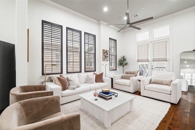 living room featuring visible vents, recessed lighting, crown molding, ceiling fan, and wood-type flooring