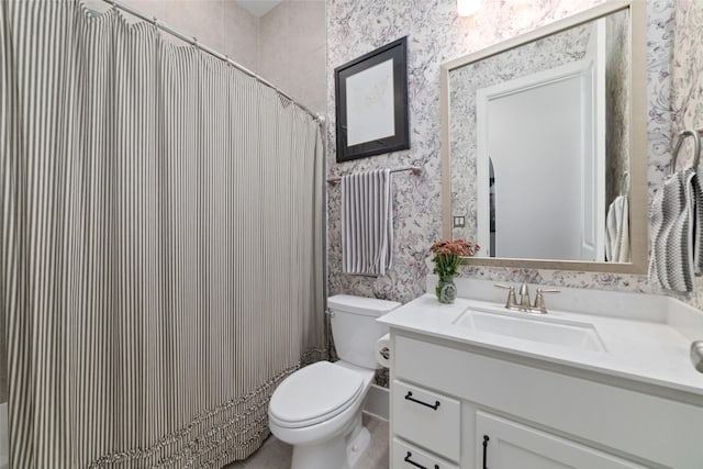 145 Lily Green Ct, Conroe, TX 77304 - bathroom with wallpapered walls, vanity, and toilet
