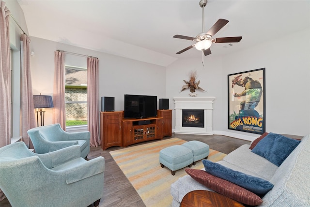 145 Lily Green Ct, Conroe, TX 77304 - living room with a ceiling fan, wood finished floors, a glass covered fireplace, and lofted ceiling