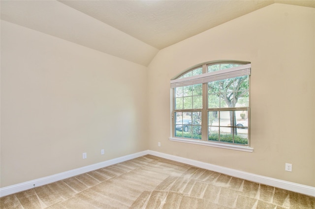 8523 Dolan Heights Ct, Cypress, TX 77433 - spare room with vaulted ceiling, light carpet, and baseboards