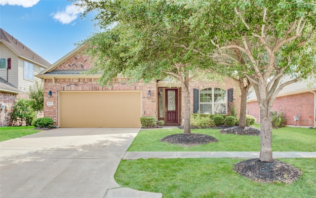 8523 Dolan Heights Ct, Cypress, TX 77433 - view of front facade featuring concrete driveway, a garage, brick siding, and a front yard