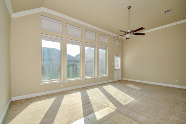 8523 Dolan Heights Ct, Cypress, TX 77433 - empty room with visible vents, ceiling fan, light carpet, crown molding, and baseboards