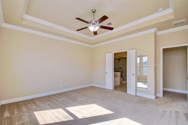 8523 Dolan Heights Ct, Cypress, TX 77433 - unfurnished bedroom with a tray ceiling, crown molding, visible vents, and light colored carpet