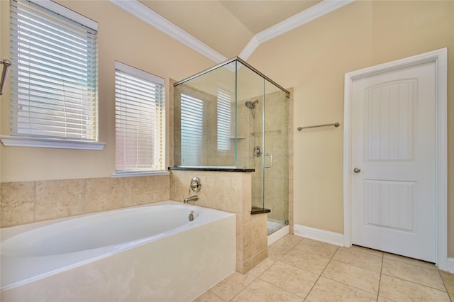 8523 Dolan Heights Ct, Cypress, TX 77433 - bathroom featuring a bath, baseboards, tile patterned flooring, a shower stall, and ornamental molding