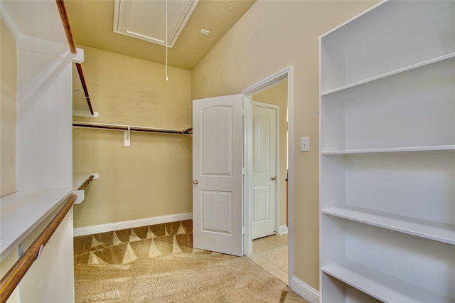 8523 Dolan Heights Ct, Cypress, TX 77433 - walk in closet featuring tile patterned floors, attic access, and carpet floors