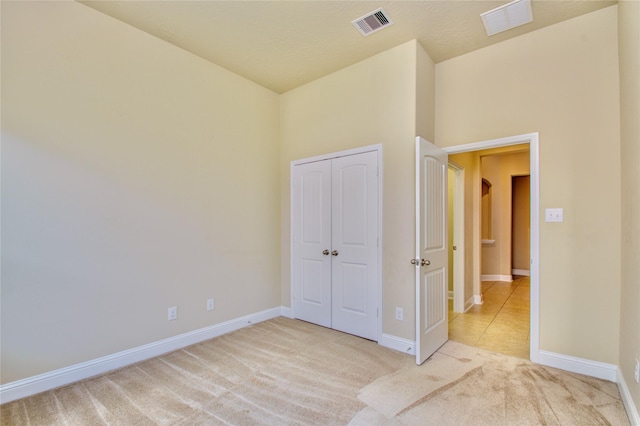 8523 Dolan Heights Ct, Cypress, TX 77433 - unfurnished bedroom with a closet, visible vents, baseboards, and carpet floors