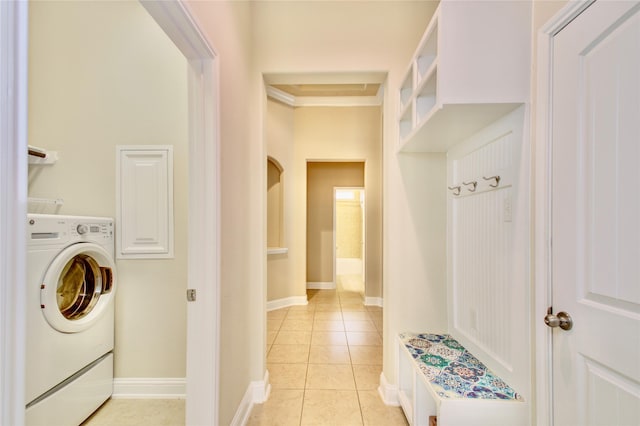 8523 Dolan Heights Ct, Cypress, TX 77433 - washroom with washer / dryer, laundry area, light tile patterned floors, and baseboards