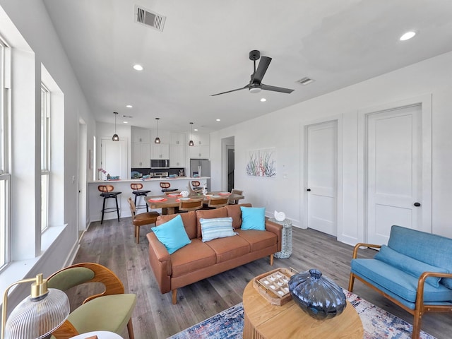525 Annabelle Dr, Gilchrist, TX 77617 - living room with ceiling fan, recessed lighting, visible vents, and wood finished floors