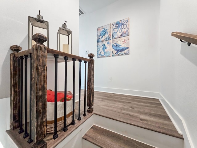 525 Annabelle Dr, Gilchrist, TX 77617 - stairs featuring baseboards and wood finished floors
