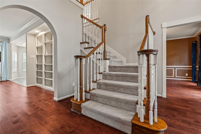 6615 Cypress Village Dr, Sugar Land, TX 77479 - stairs featuring crown molding, wood finished floors, baseboards, and arched walkways