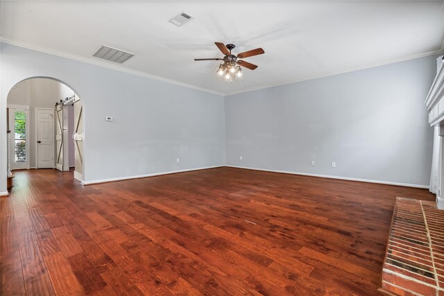 6615 Cypress Village Dr, Sugar Land, TX 77479 - spare room featuring arched walkways, ceiling fan, visible vents, and hardwood / wood-style flooring