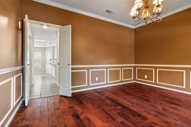 6615 Cypress Village Dr, Sugar Land, TX 77479 - unfurnished room featuring visible vents, wainscoting, a chandelier, ornamental molding, and hardwood / wood-style flooring
