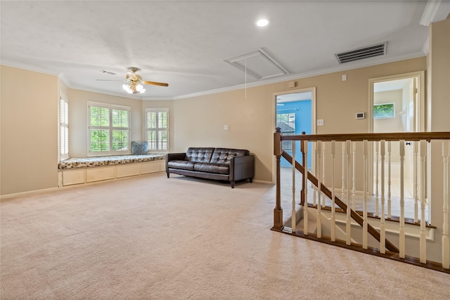 6615 Cypress Village Dr, Sugar Land, TX 77479 - living area with ornamental molding, visible vents, attic access, and an upstairs landing