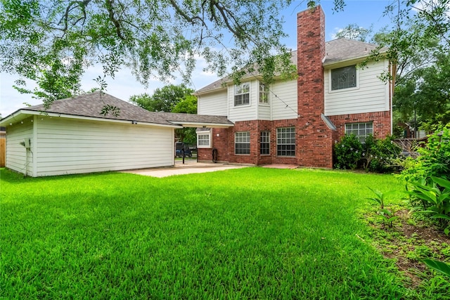 6615 Cypress Village Dr, Sugar Land, TX 77479 - back of property with fence, brick siding, a patio, a chimney, and a lawn