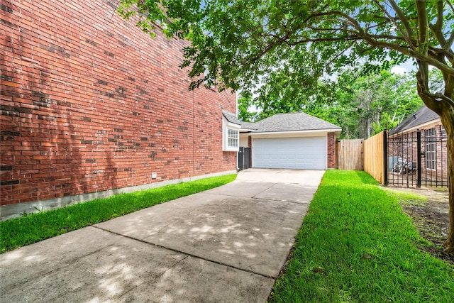 6615 Cypress Village Dr, Sugar Land, TX 77479 - view of side of home with a yard, brick siding, fence, a garage, and concrete driveway