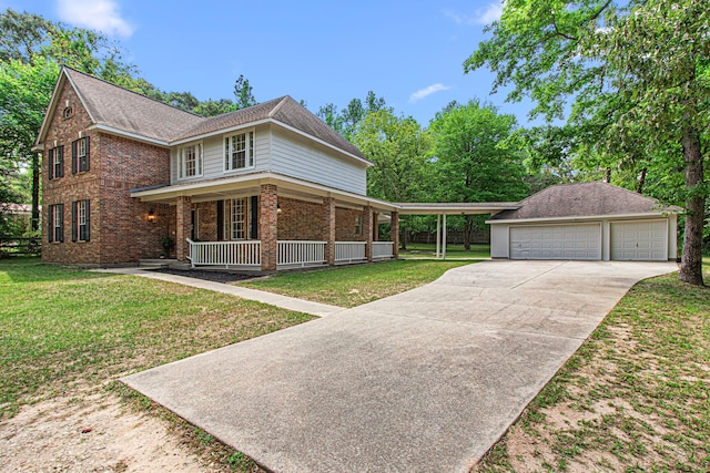 6811 S Trace Dr, Magnolia, TX 77354 - view of front of property featuring covered porch, brick siding, a front yard, and a detached garage