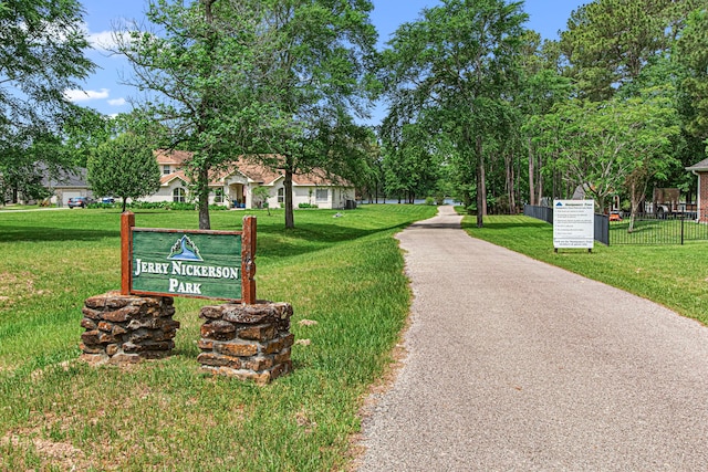 6811 S Trace Dr, Magnolia, TX 77354 - view of home's community with fence and a lawn
