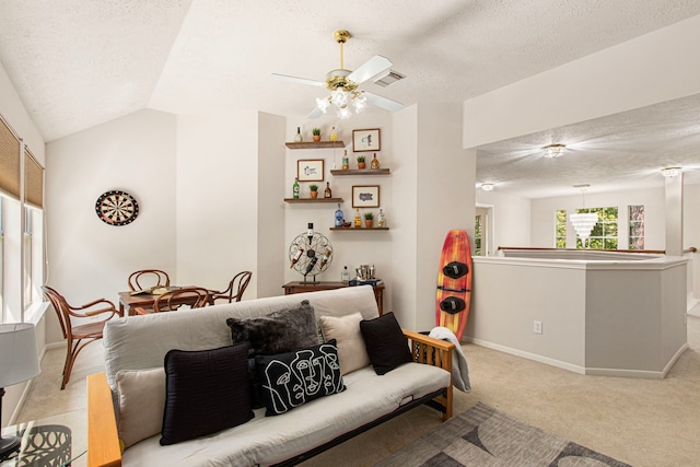 6811 S Trace Dr, Magnolia, TX 77354 - living area with lofted ceiling, a textured ceiling, visible vents, light carpet, and a ceiling fan