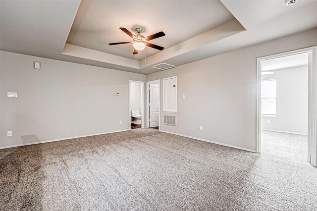 1339 Kane Ct, Rosenberg, TX 77471 - carpeted empty room featuring visible vents, baseboards, a raised ceiling, and ceiling fan