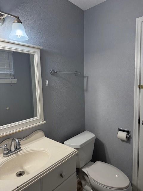 1101 E Brown Ln, Deer Park, TX 77536 - half bath featuring vanity and toilet
