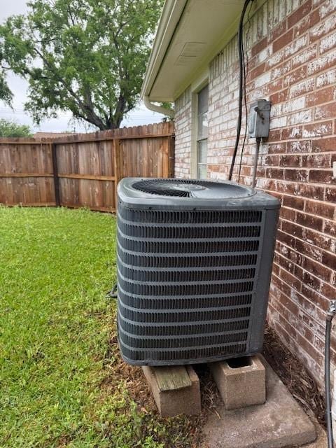1101 E Brown Ln, Deer Park, TX 77536 - exterior view of central AC unit, brick siding, and fence