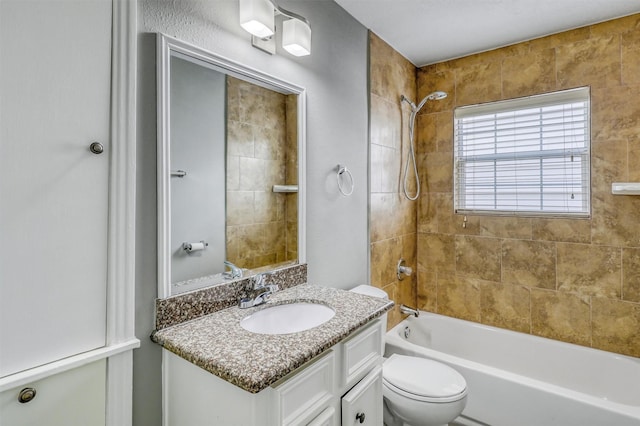 full bathroom featuring toilet, vanity, and washtub / shower combination