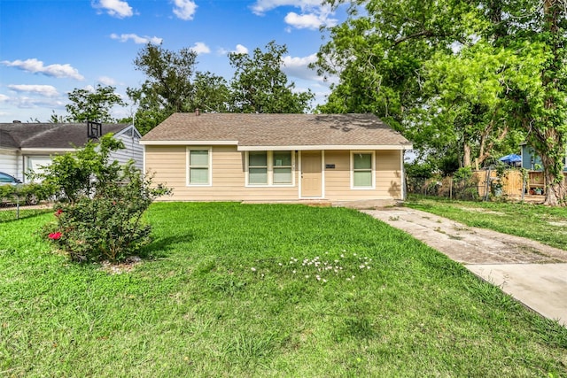 single story home featuring fence and a front yard