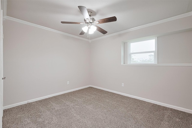 spare room featuring ornamental molding, carpet, baseboards, and ceiling fan