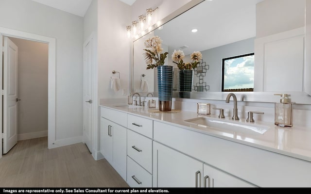 2706 Obsidian Dr, Rosharon, TX 77583 - full bathroom featuring recessed lighting, double vanity, baseboards, and a sink