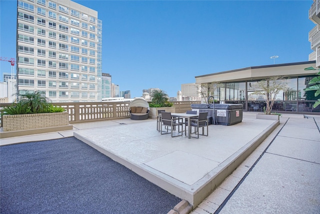 view of patio / terrace with a city view and outdoor dining space