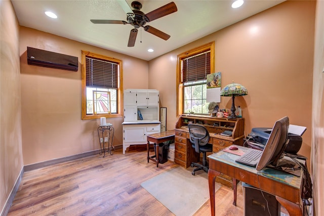 120 Rebecca St, Houston, TX 77022 - home office featuring healthy amount of natural light, light wood-style flooring, ceiling fan, an AC wall unit, and recessed lighting
