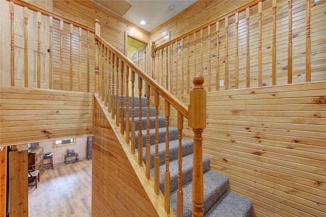120 Rebecca St, Houston, TX 77022 - stairway featuring wood finished floors and wood walls