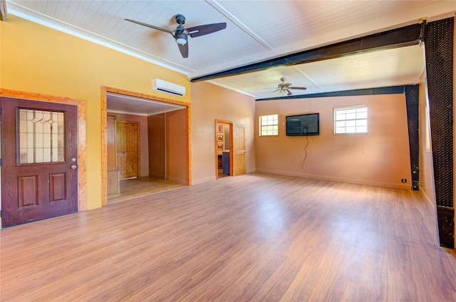 120 Rebecca St, Houston, TX 77022 - spare room with a ceiling fan, light wood-style floors, ornamental molding, a wall mounted AC, and baseboards