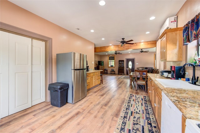 120 Rebecca St, Houston, TX 77022 - kitchen with freestanding refrigerator, a sink, recessed lighting, open floor plan, and light wood-type flooring