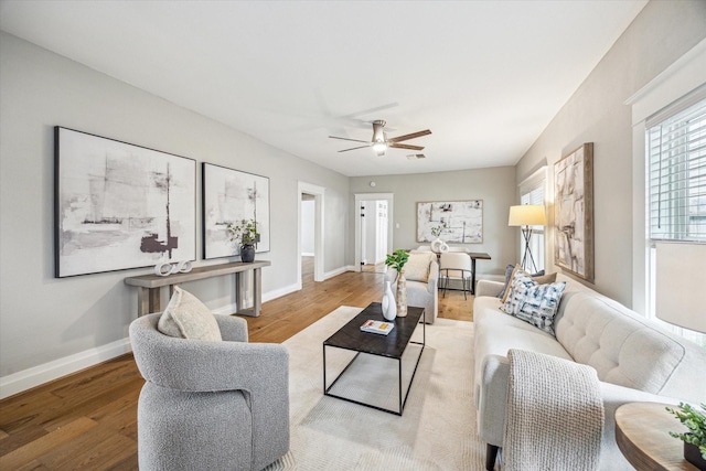 1411 Tulane St, Houston, TX 77008 - living area with wood finished floors, ceiling fan, and baseboards