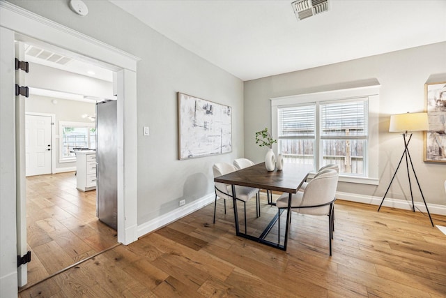 1411 Tulane St, Houston, TX 77008 - dining space with hardwood / wood-style floors and baseboards