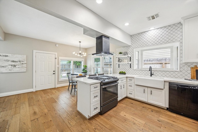 1411 Tulane St, Houston, TX 77008 - kitchen with black dishwasher, range with gas cooktop, wall chimney range hood, a sink, and white cabinets