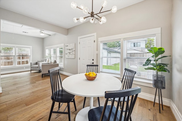 1411 Tulane St, Houston, TX 77008 - dining area featuring baseboards, light wood-style flooring, a chandelier, and a ceiling fan