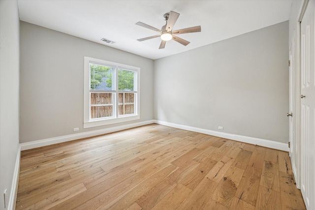 1411 Tulane St, Houston, TX 77008 - empty room with light wood-style flooring, ceiling fan, and baseboards