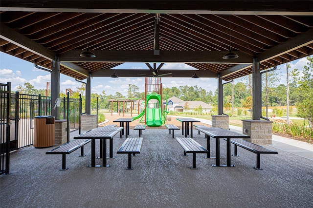 view of patio / terrace with playground community and fence